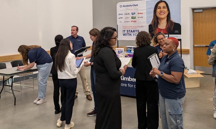 Students talk with recruiters at the WIE Coporate Open House Career Fair