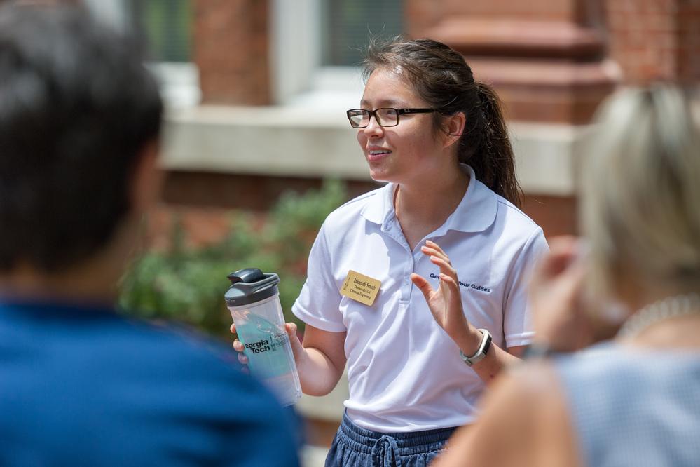 A student guide leading a campus tour.