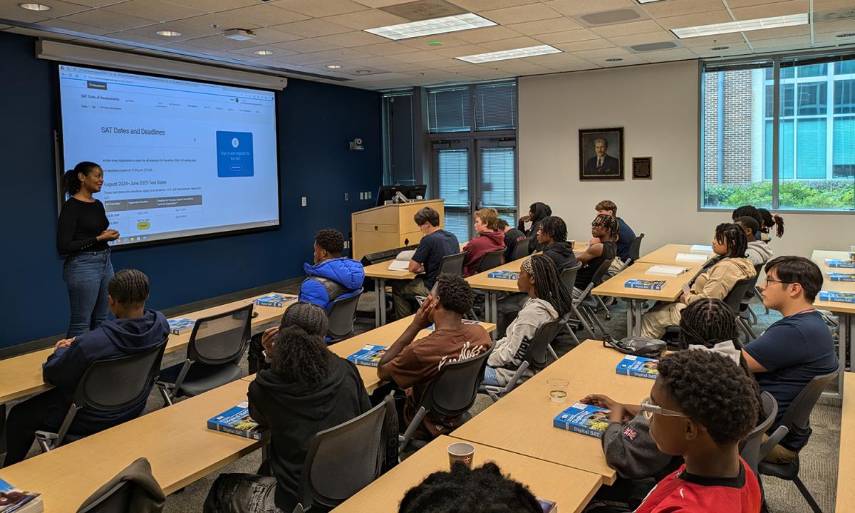 Students in a classroom listen to SAT prep tips and techniques